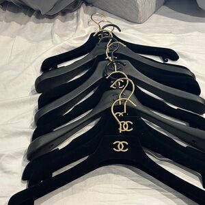 CHANEL Black Hangers with Gold Accents
